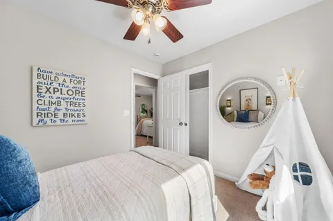 a bedroom with a bed and a dresser