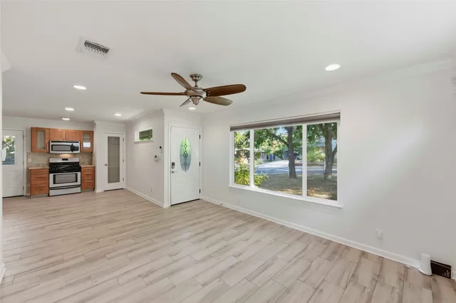 a view of house with backyard