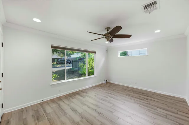 a view of a livingroom with a flat screen tv and window