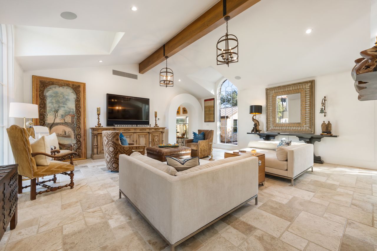 11941 Overlook Pass Austin, TX 78738 - Photo 11 of 40 Spacious living area featuring light-toned tile flooring, vaulted ceilings with exposed wood beams, and recessed lighting