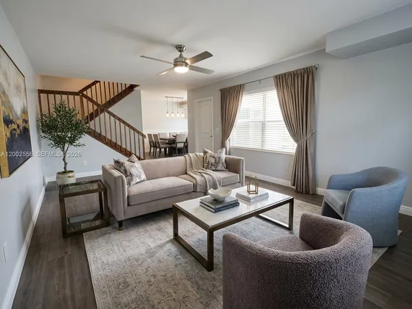 a living room with furniture and a window