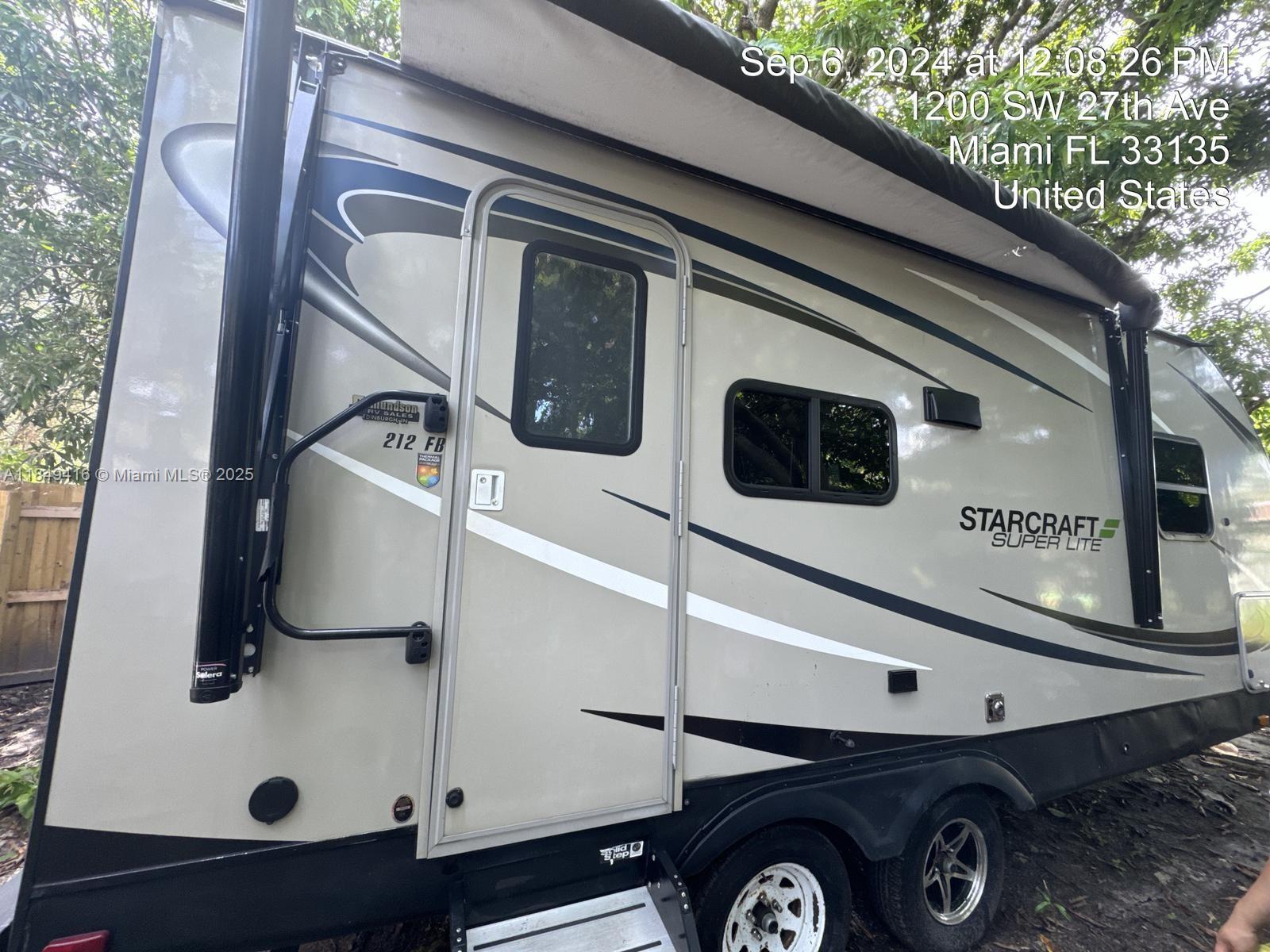 2723 Southwest 13th Street Miami, FL 33135 - Photo 1 of 4 a front view of a house with parking area