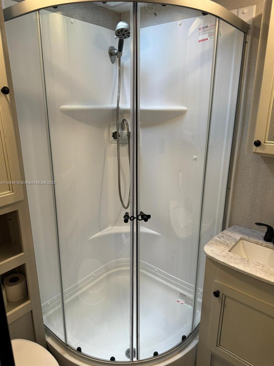 2723 Southwest 13th Street Miami, FL 33135 - Photo 4 of 4 a bathroom with a sink toilet and shower