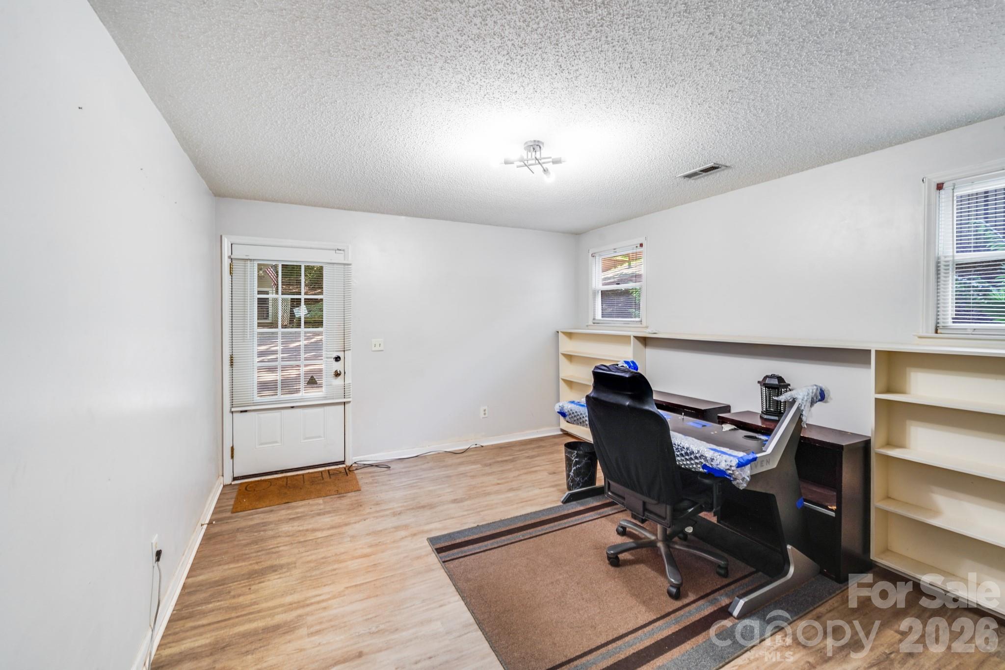 2116 Bon Villa Way Fort Mill, SC 29708 - Photo 16 of 28 a workspace with furniture and wooden floor