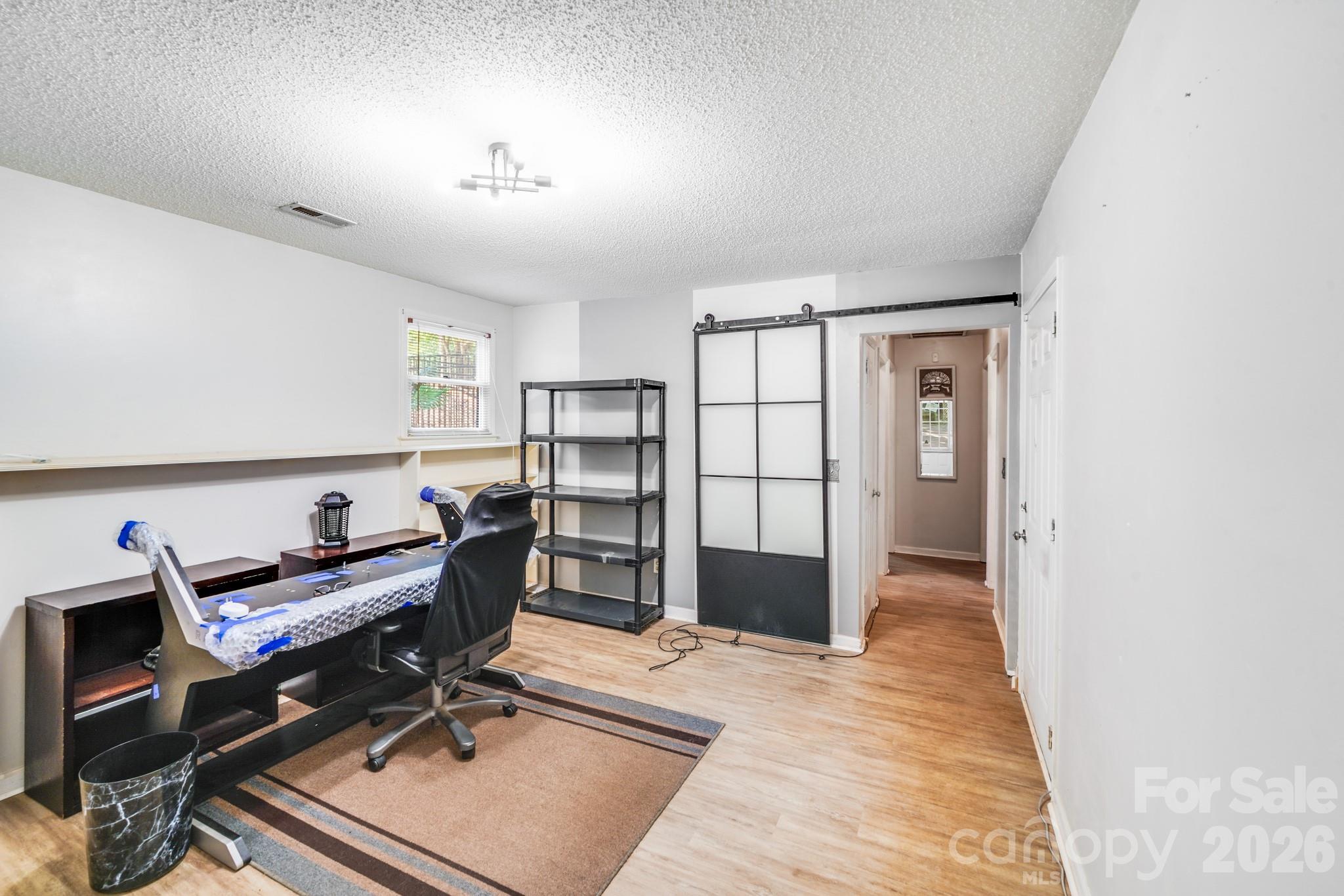 2116 Bon Villa Way Fort Mill, SC 29708 - Photo 17 of 28 a view of a workspace with furniture and a window