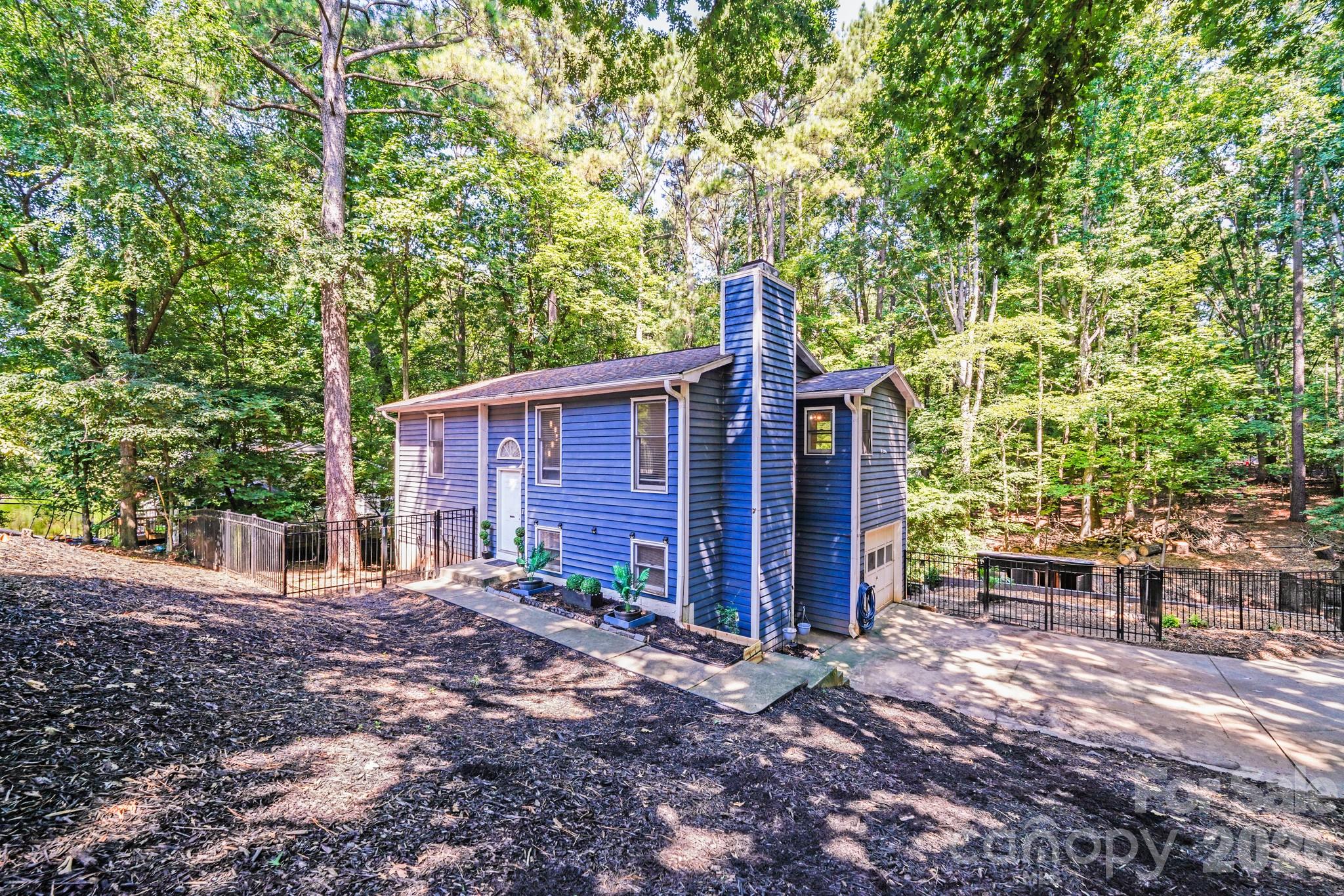 2116 Bon Villa Way Fort Mill, SC 29708 - Photo 2 of 28 a view of a house with backyard and trees