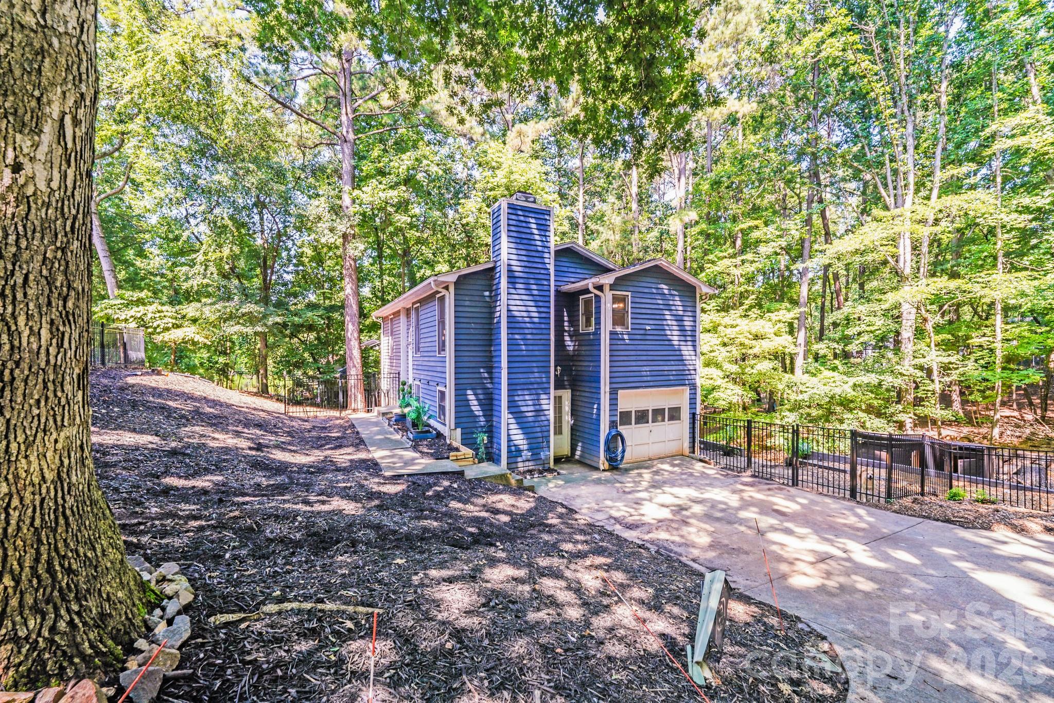 2116 Bon Villa Way Fort Mill, SC 29708 - Photo 24 of 28 a view of a house with a yard and large tree