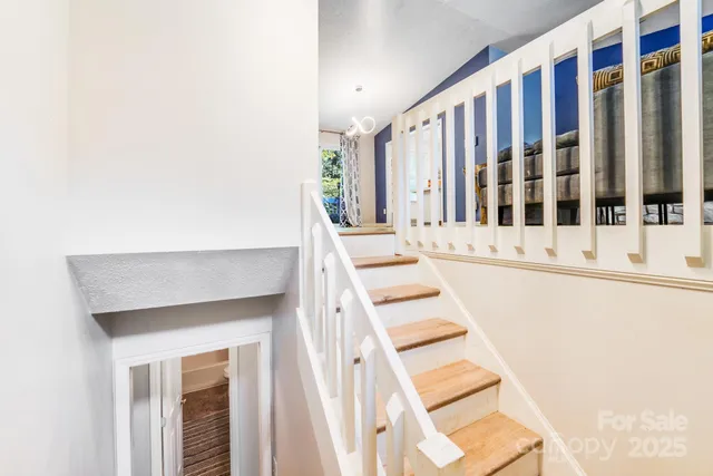 a living room with fireplace furniture and a flat screen tv