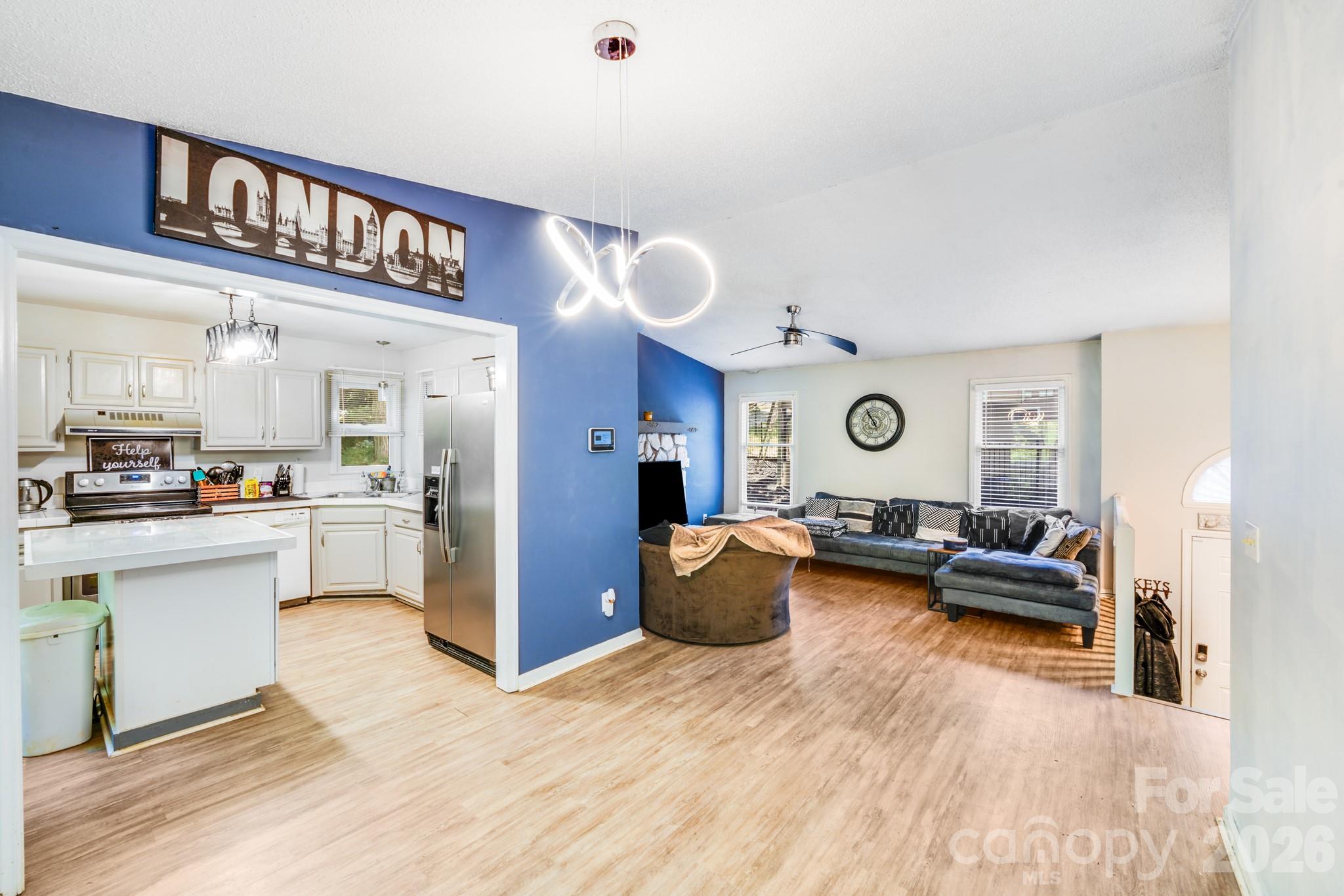 2116 Bon Villa Way Fort Mill, SC 29708 - Photo 8 of 28 a living room with furniture kitchen view and a refrigerator