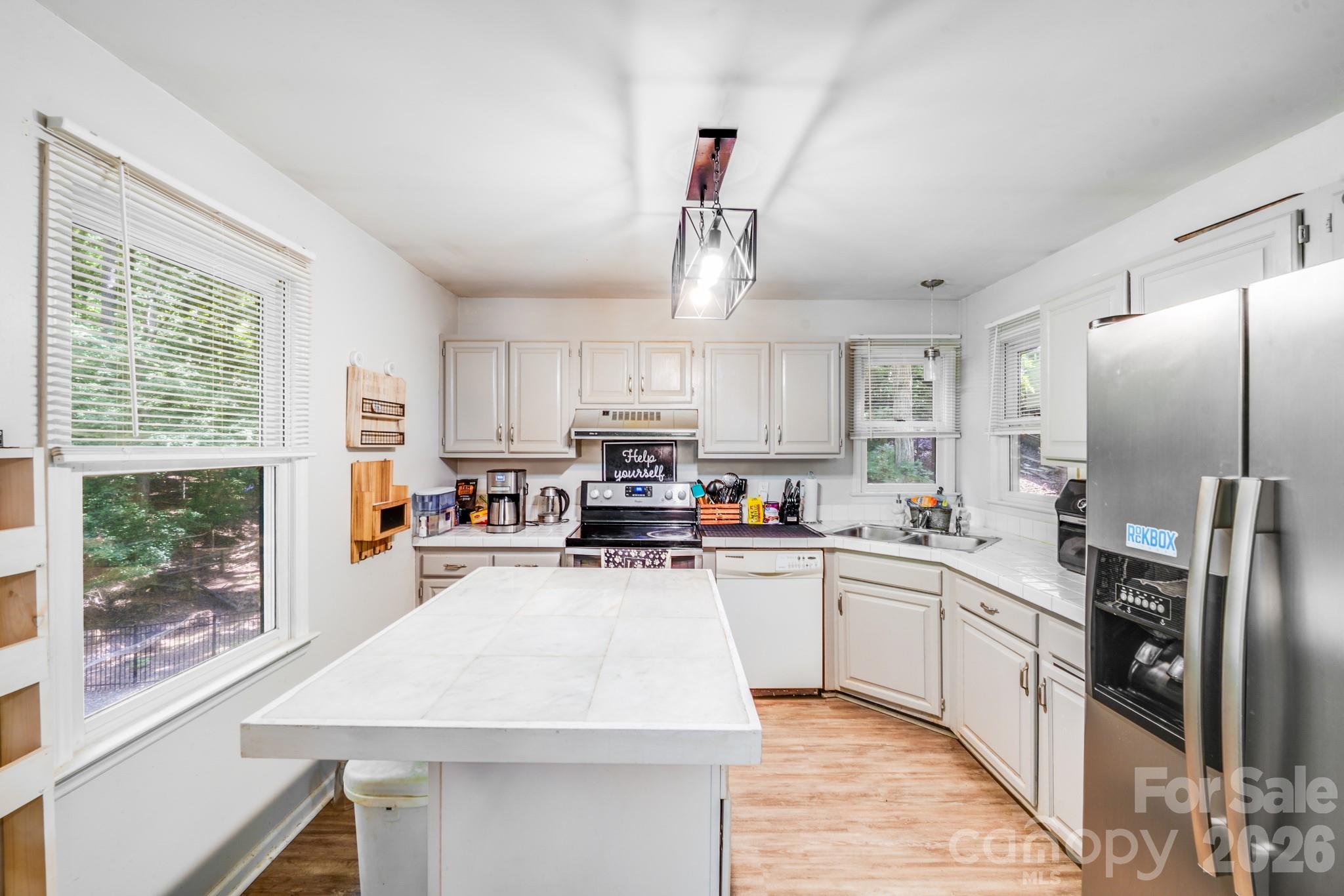 2116 Bon Villa Way Fort Mill, SC 29708 - Photo 10 of 28 a kitchen with stainless steel appliances a refrigerator sink and cabinets