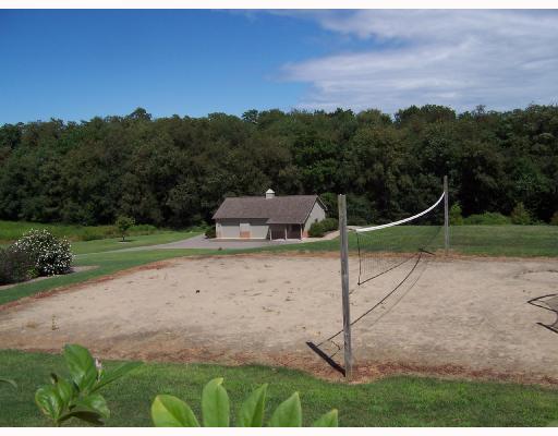 333 Whitestown Road Harmony, PA 16037 - Photo 11 of 16 Other. A sand volleyball court is located behind the in-ground pool area. A portion of the woods behind the 2 stall detached garage is part of the property.