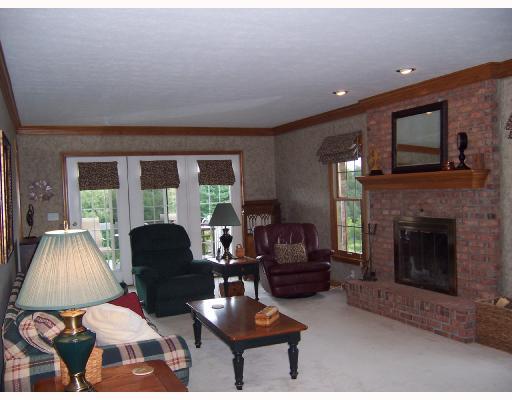 333 Whitestown Road Harmony, PA 16037 - Photo 5 of 16 Den/Family/Great Room. The family room boasts a wood burning fireplace as the focal point to the room. A french door leads out to the rear deck that overlooks the in-ground pool.