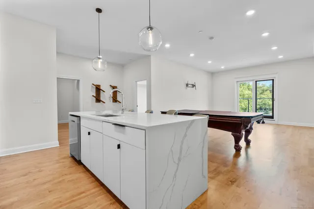 a bathroom with a sink a vanity and a mirror