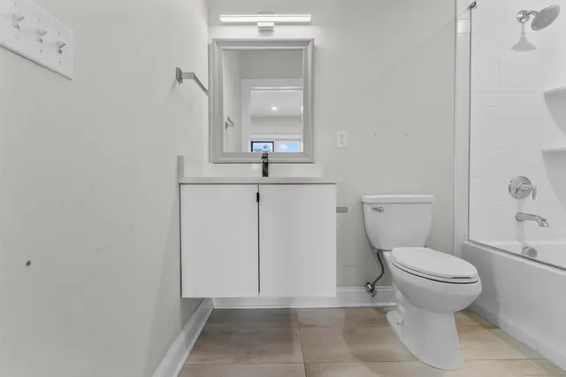 a bathroom with a toilet and a sink