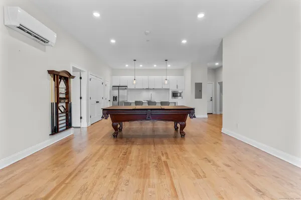 a room with wooden floor and furniture