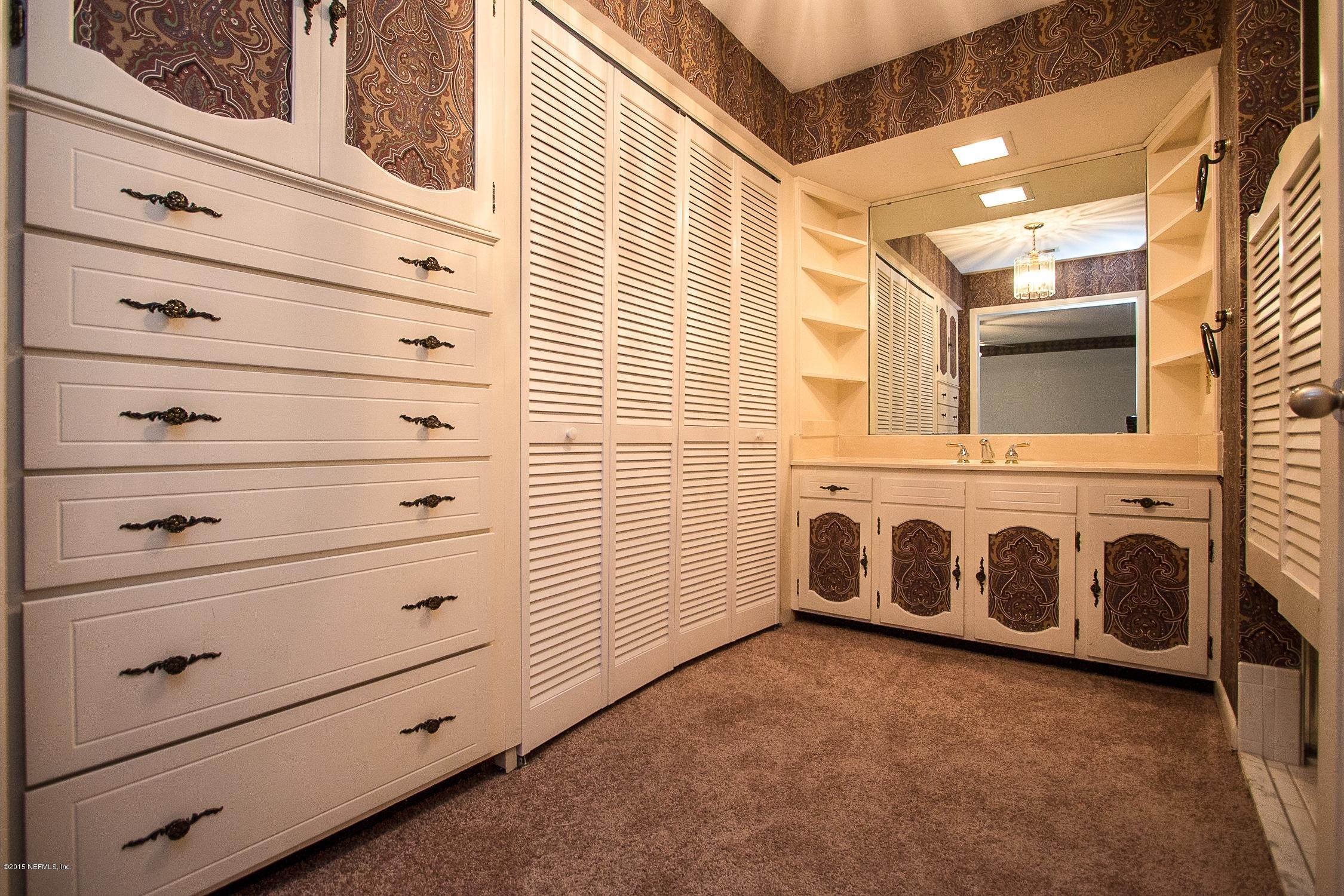 9435 Ponder Road Jacksonville, FL 32257 - Photo 18 of 33 a view of a dresser and storage