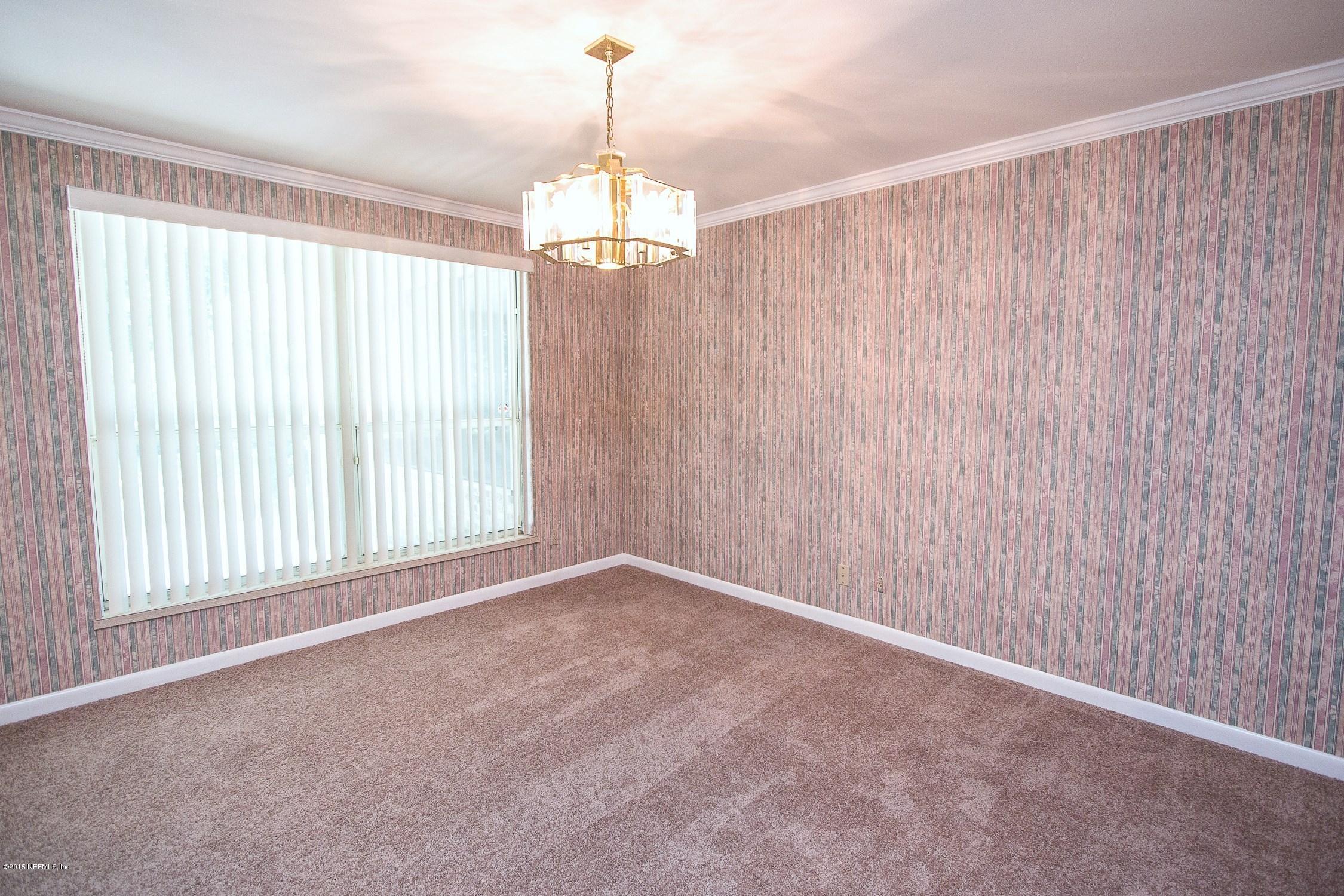9435 Ponder Road Jacksonville, FL 32257 - Photo 8 of 33 a view of an empty room with a window