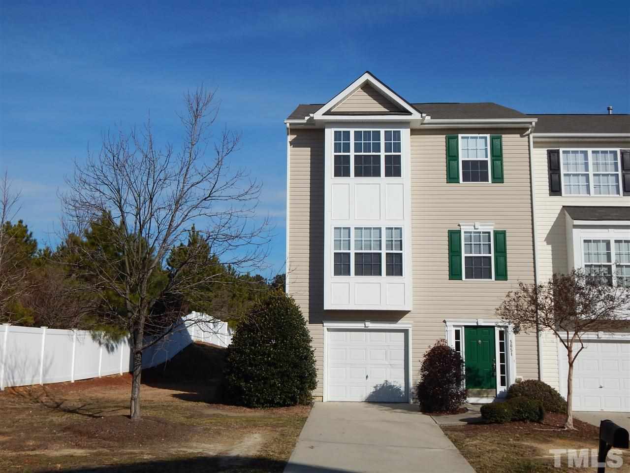 5051 Neuse Commons Lane Raleigh, NC 27616 - Photo 1 of 23 a front view of a house with a yard