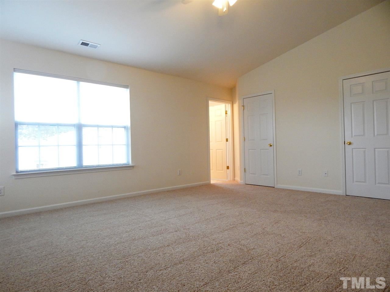 5051 Neuse Commons Lane Raleigh, NC 27616 - Photo 12 of 23 a view of an empty room with a window