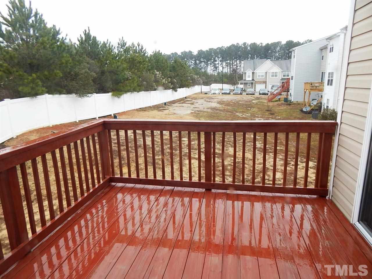 5051 Neuse Commons Lane Raleigh, NC 27616 - Photo 16 of 23 a view of balcony with wooden floor