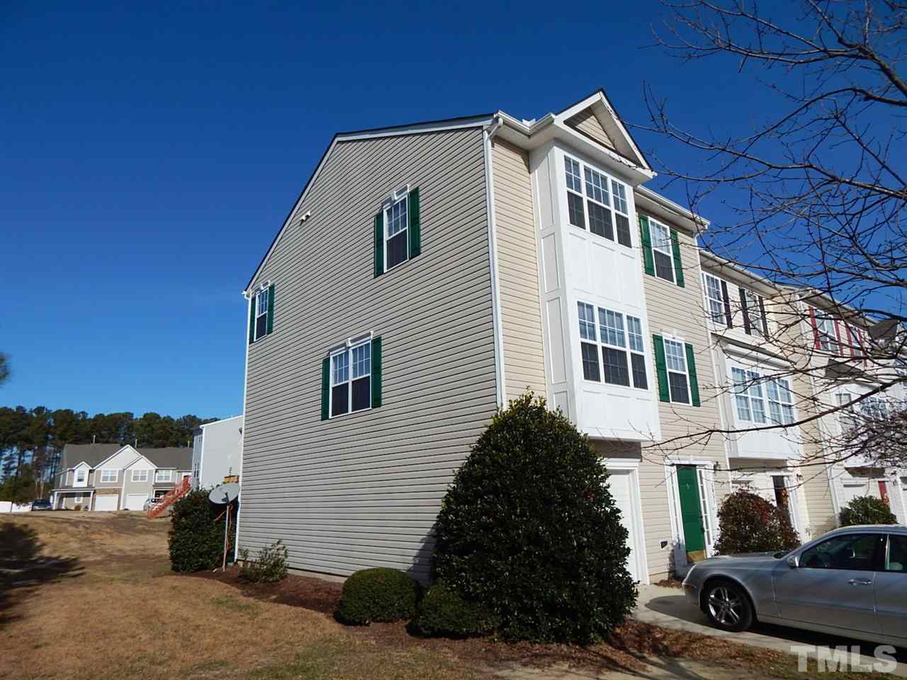 5051 Neuse Commons Lane Raleigh, NC 27616 - Photo 17 of 23 a front view of a house with a yard