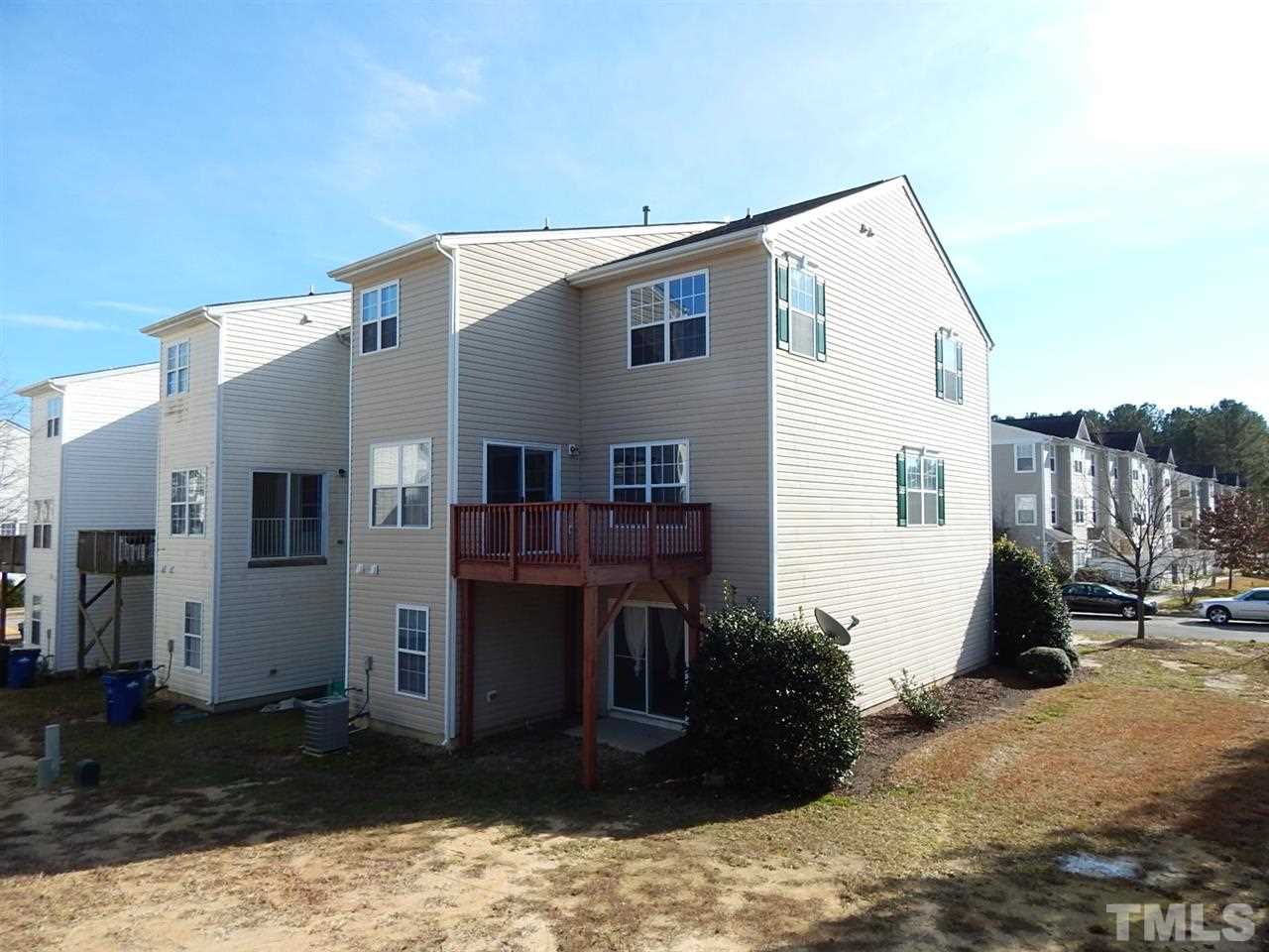 5051 Neuse Commons Lane Raleigh, NC 27616 - Photo 18 of 23 a view of a house with a yard