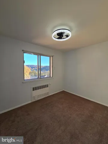 an empty room with a empty space and a window