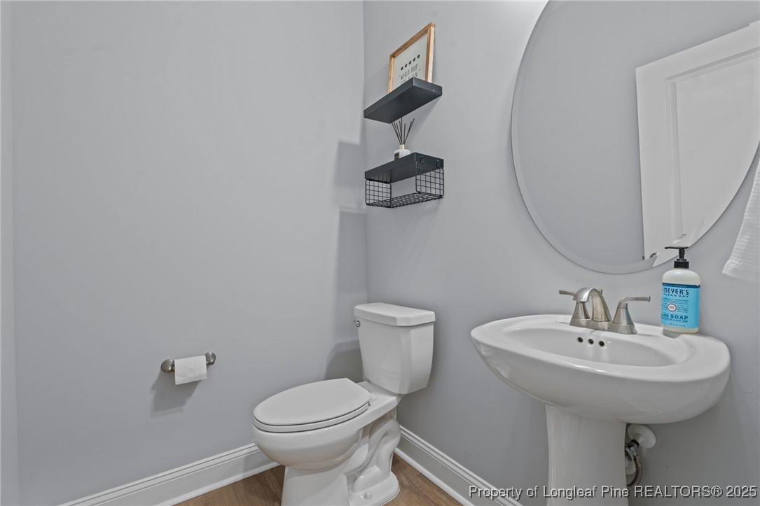 125 Solomon Drive Cameron, NC 28326 - Photo 17 of 49 a bathroom with a toilet sink and mirror