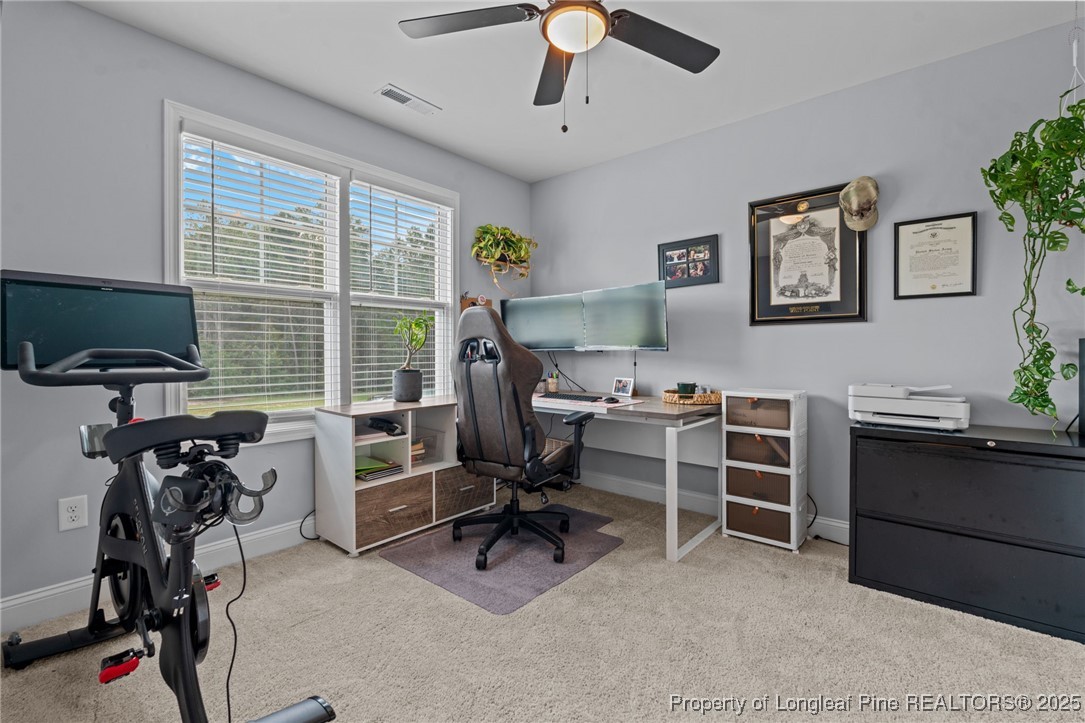 125 Solomon Drive Cameron, NC 28326 - Photo 19 of 49 a view of a workspace with furniture and a window
