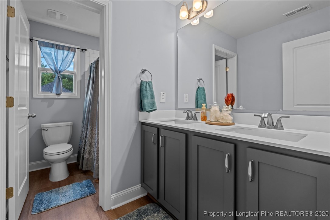 125 Solomon Drive Cameron, NC 28326 - Photo 20 of 49 a bathroom with a toilet sink and mirror