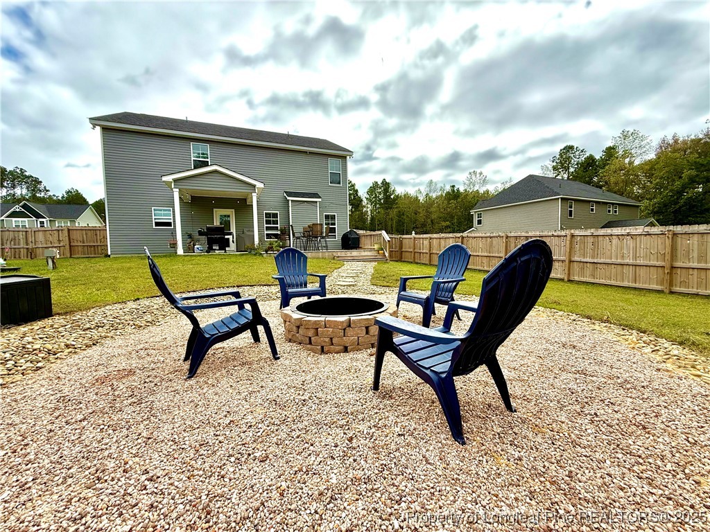 125 Solomon Drive Cameron, NC 28326 - Photo 2 of 49 a view of a backyard with furniture and a garden