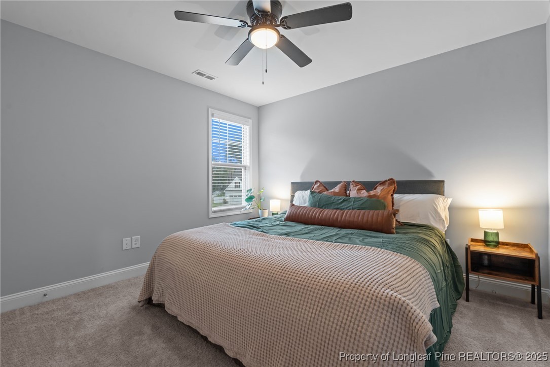 125 Solomon Drive Cameron, NC 28326 - Photo 22 of 49 a bedroom with bed and window