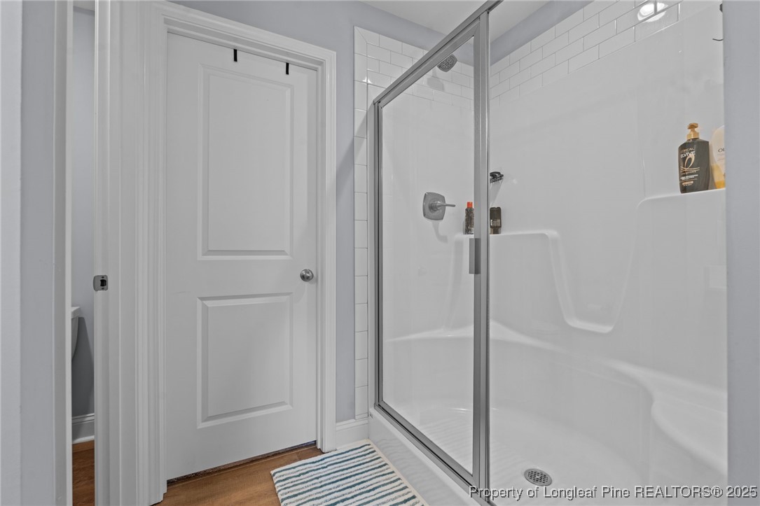 125 Solomon Drive Cameron, NC 28326 - Photo 27 of 49 a bathroom with a glass shower door