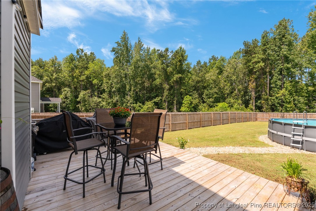 125 Solomon Drive Cameron, NC 28326 - Photo 32 of 49 a view of a swimming pool with chair and table