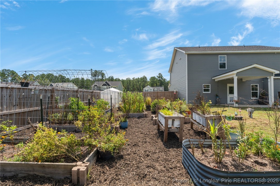 125 Solomon Drive Cameron, NC 28326 - Photo 34 of 49 a front view of a house with a garden view