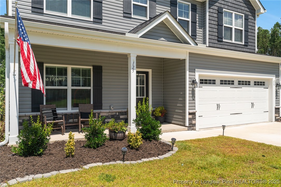 125 Solomon Drive Cameron, NC 28326 - Photo 44 of 49 a front view of a house with garden