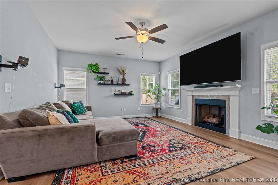 125 Solomon Drive Cameron, NC 28326 - Photo 5 of 49 a living room with furniture a flat screen tv and a fireplace