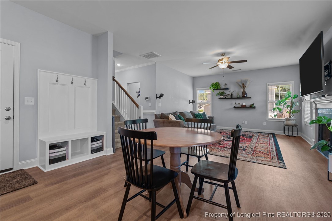 125 Solomon Drive Cameron, NC 28326 - Photo 10 of 49 a view of a dining room with furniture and wooden floor