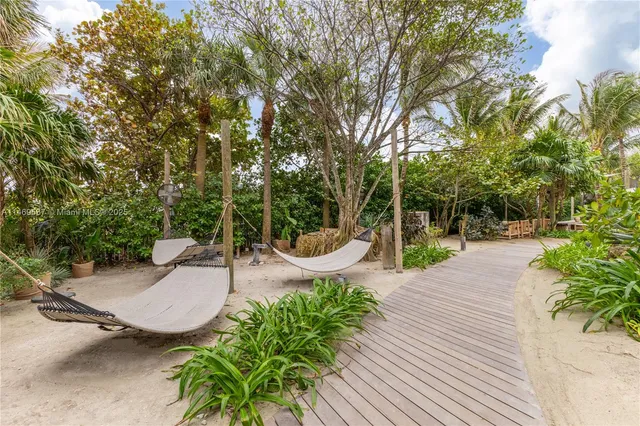 a view of a hallway and dining room