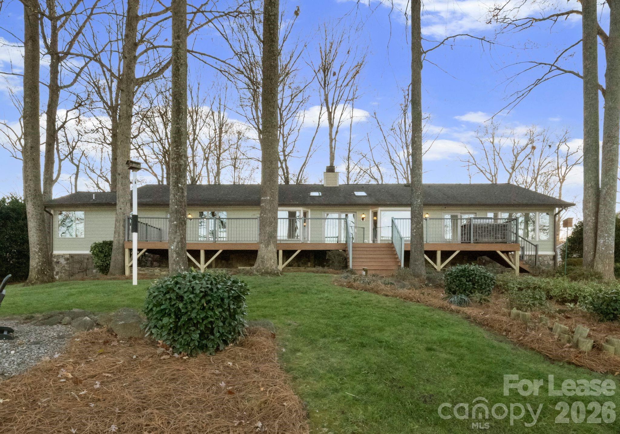 19709 Stough Farm Road Cornelius, NC 28031 - Photo 33 of 48 a view of a house with a yard and sitting area