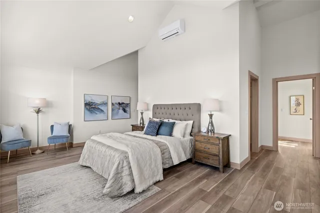 a bedroom with a bed and a lamp