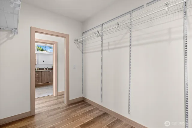 a view of a bathroom with wooden floor