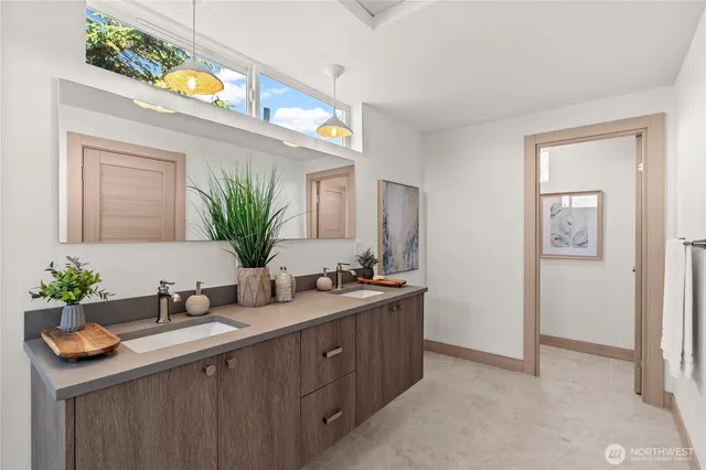 a bathroom with a sink a vanity and a mirror