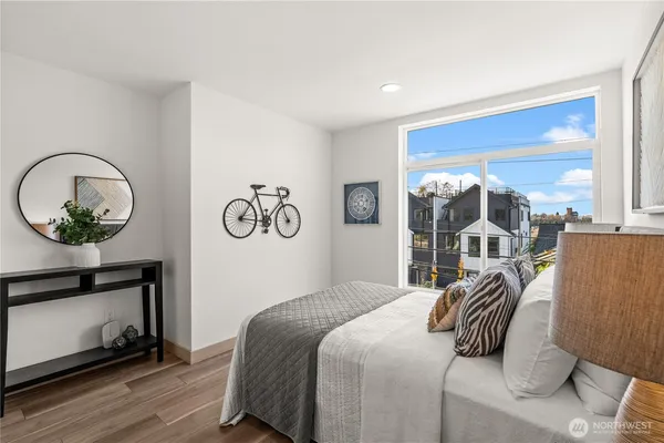 a bedroom with a bed and a mirror