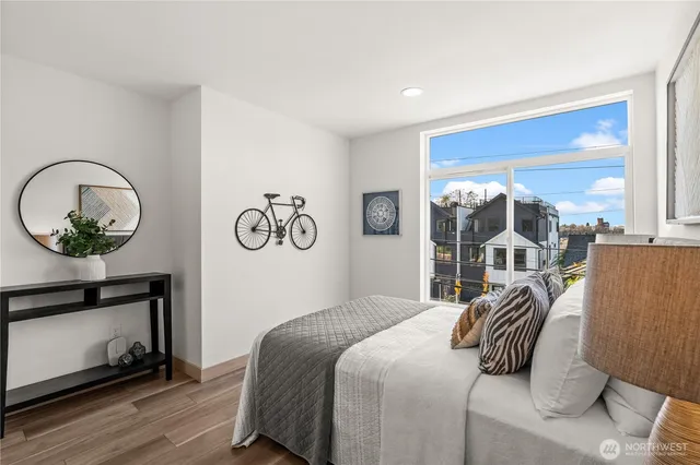 a bedroom with a bed and a mirror