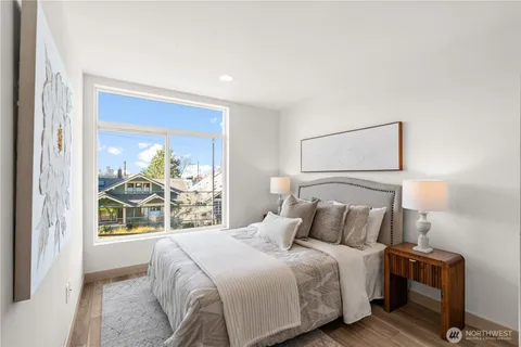 a bedroom with a large bed and a window