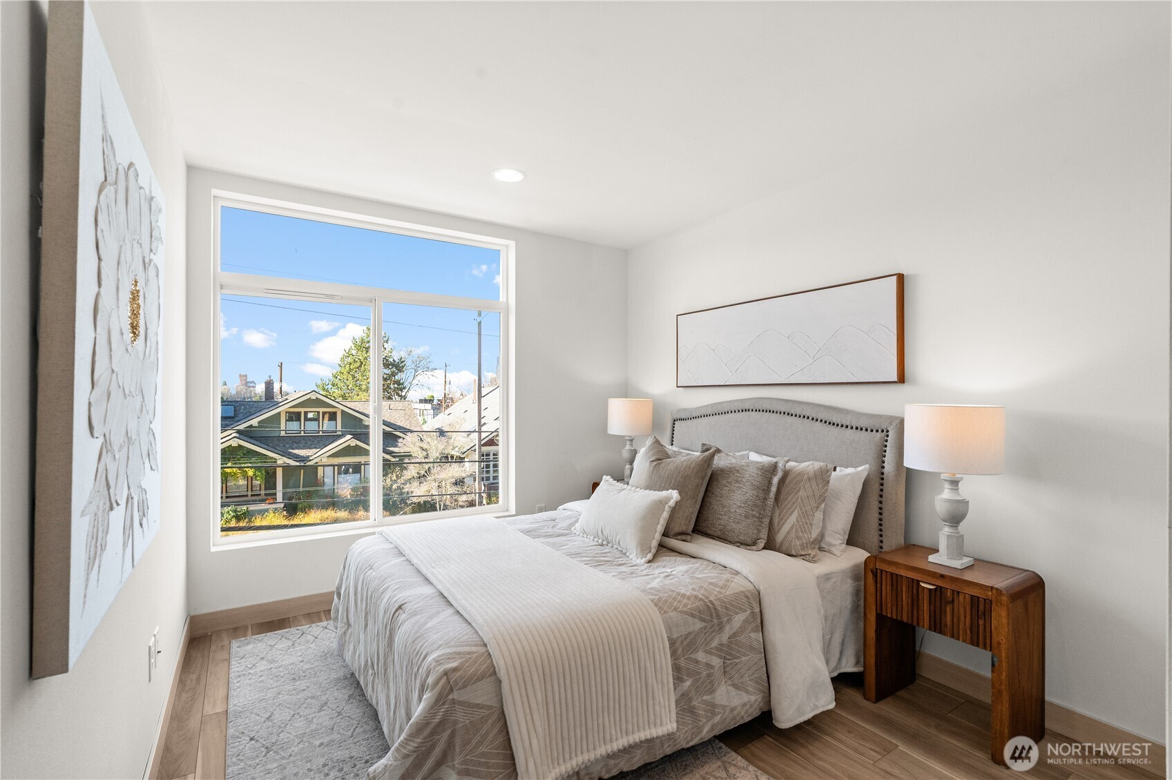 1132 31st Avenue South Seattle, WA 98144 - Photo 22 of 36 a bedroom with a large bed and a window