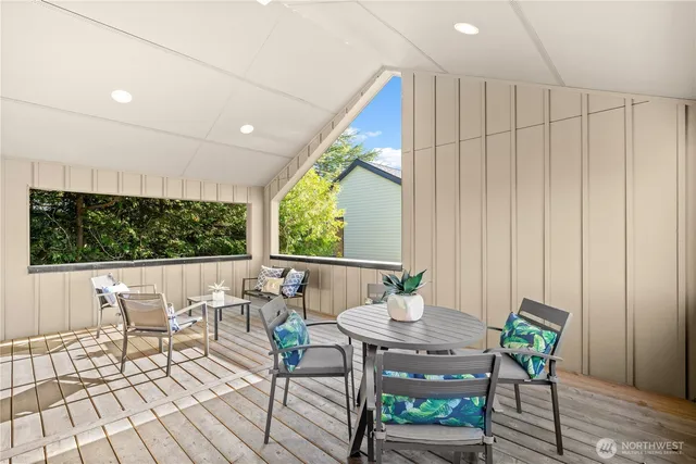 a view of a dining room with furniture window and outside view