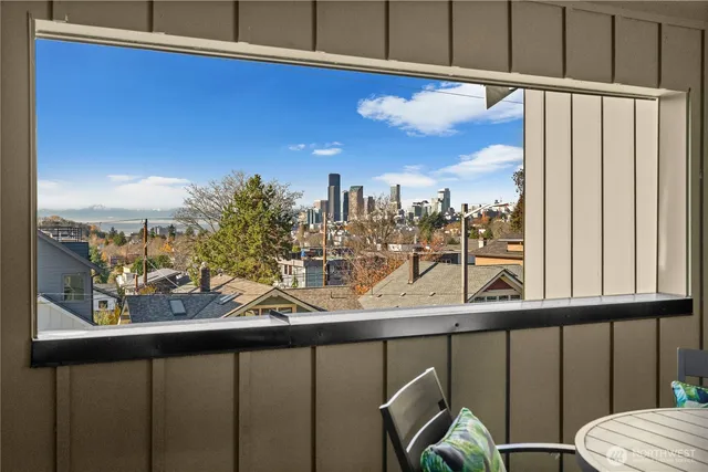 a view of a balcony with furniture and a window