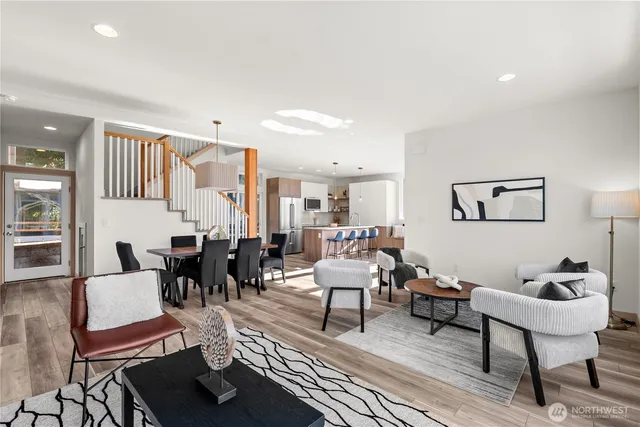 a living room with furniture and a lamp